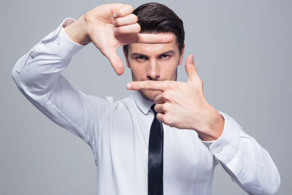 Businessman making frame gesture