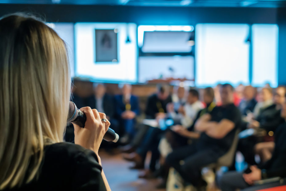 Female presenter speaks to audiences